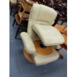 AN EKORNES STRESSLESS RECLINING CHAIR AND STOOL.