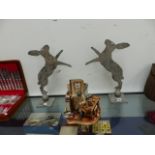 A PAIR OF METAL SILHOUETTE BOXING HARES.