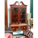 A GEORGIAN STYLE MAHOGANY CABINET ON STAND.