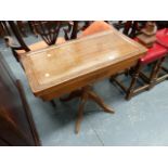 A COLONIAL HARDWOOD FOLD OVER CARD TABLE.