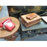 A HUMIDOR, A DESK STAND AND A VINTAGE TELEPHONE.