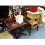 A BUTLER'S TRAY AND STAND TOGETHER WITH A BEDSIDE CABINET AND A LAMP.