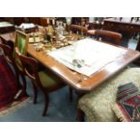 A VICTORIAN MAHOGANY DINING TABLE.