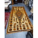 AN ORIENTAL TRIBAL RUG.