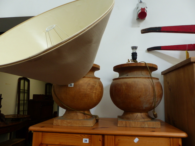 A PAIR OF LARGE TURNED WOOD LAMPS.