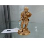 AN ORIENTAL SIGNED FIGURE.