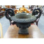 A CAST IRON GARDEN URN.