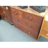 A COTSWOLD SCHOOL OAK SMALL CHEST OF TWO SHORT AND TWO LONG DRAWERS.