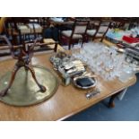 A QTY OF PLATEDWARE, A BRASS TOPPED TABLE AND VARIOUS GLASSWARE.