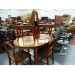 A MAHOGANY EXTENDING DINING TABLE WITH EIGHT MATCHING CHAIRS, CANADIAN.