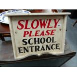 A VINTAGE SCHOOL SIGN.