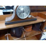 A MANTLE CLOCK AND BINOCULARS.