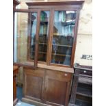 AN OAK BOOKCASE CABINET.