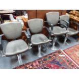 FOUR ADJUSTABLE BARBER'S CHAIRS.