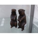 A PAIR OF BRONZED OTTERS.