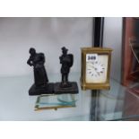A BRASS CARRIAGE CLOCK FOR RESTORATION AND A PAIR OF BRONZED FIGURES.
