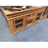 A HARDWOOD SIDEBOARD CABINET.