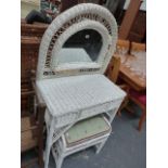 A WICKER DRESSING TABLE AND STOOL.