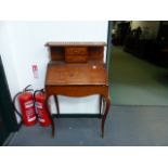 A CONTINENTAL INLAID SMALL WRITING BUREAU.