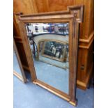 A GILT FRAMED WALL MIRROR.