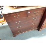 A GEORGIAN MAHOGANY CHEST OF TWO SHORT AND THREE LONG DRAWERS.