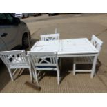 A PAINTED PATIO TABLE AND FIVE CHAIRS.