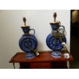 A PAIR OF POTTERY TABLE LAMPS.