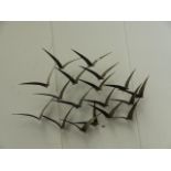 A METAL WALL DISPLAY FLOCK OF BIRDS.