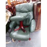 A LEATHER UPHOLSTERED ARMCHAIR AND STOOL.