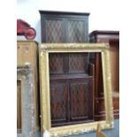 A FAUX ROSEWOOD PAINTED TWO PART SIDE CABINET WITH LATTICE DECORATED DOORS.
