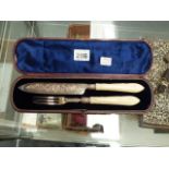 A SILVER HALLMARKED CASED KNIFE AND FORK.
