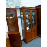 A MODERN GLAZED SIDE CABINET AND A CORNER CABINET.