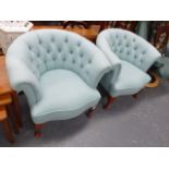 A PAIR OF BUTTON BACK ARMCHAIRS.