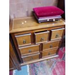 A MULTI DRAWER SIDE CABINET, A SMALL OAK BUREAU AND A VICTORIAN FOOTSTOOL.