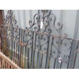 A SET OF IRON DRIVEWAY GATES.