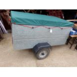 A SMALL GALVANISED BODY TRAILER WITH COVER.