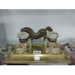 A BRASS AND GLASS INKSTAND AND A BRONZED HORSE.