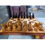 A LARGE WOODEN CHESS SET.