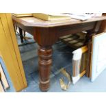 A VICTORIAN OAK DINING TABLE.