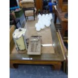 A LARGE HARDWOOD COFFEE TABLE WITH PLATE GLASS TOP.