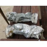 A PAIR OF RECONSTITUTED STONE LION FINIALS.