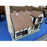 A VINTAGE DOLL'S HOUSE