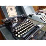 TWO VINTAGE TYPEWRITERS AND TWO BRIEFCASES.