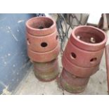 A PAIR OF TERRCTAA CHIMNEY POTS.