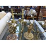 A PAIR OF GILT BRASS TABLE LAMP BASES, WALL SCONCES AND A PAIR OF CANDLESTICKS.