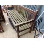 A LARGE TEAK GARDEN BENCH.