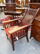 NAVAL INTEREST. AN ARTS AND CRAFTS PERIOD TEAK RECLINING ARMCHAIR MADE FROM TIMBER OF H.M.S. REKNOWN