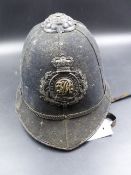 A VICTORIAN BLACK CLOTH DEVON CONSTABLE POLICE HELMET.