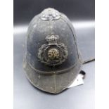 A VICTORIAN BLACK CLOTH DEVON CONSTABLE POLICE HELMET.