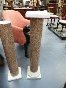 A PAIR OF PINK GRANITE AND MARBLE COLUMNS. H.106cms.